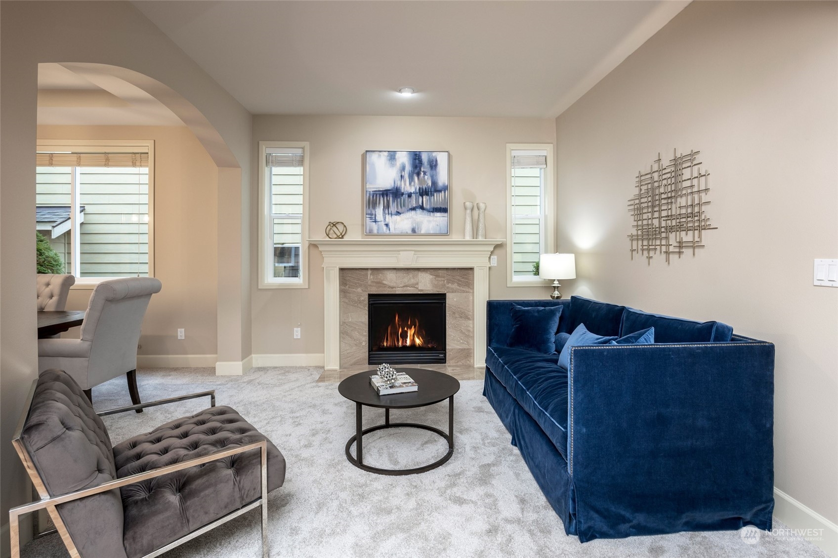5314 Northeast 17th Place Renton, WA 98059 - Photo 5 of 40 a living room with furniture a fireplace and a large window