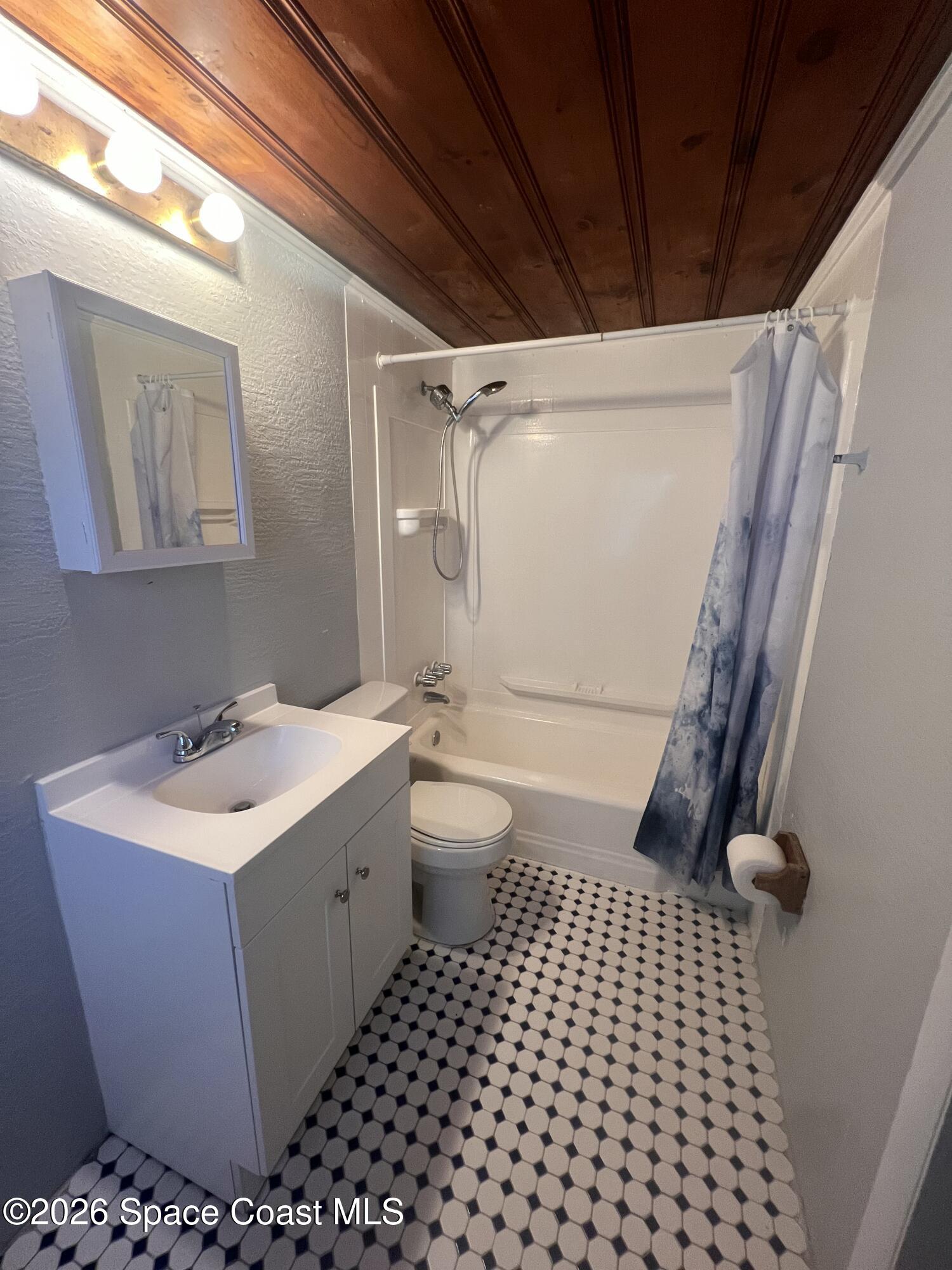 441 Vickers Street, Unit A Melbourne, FL 32935 - Photo 11 of 19 a bathroom with a sink toilet and shower