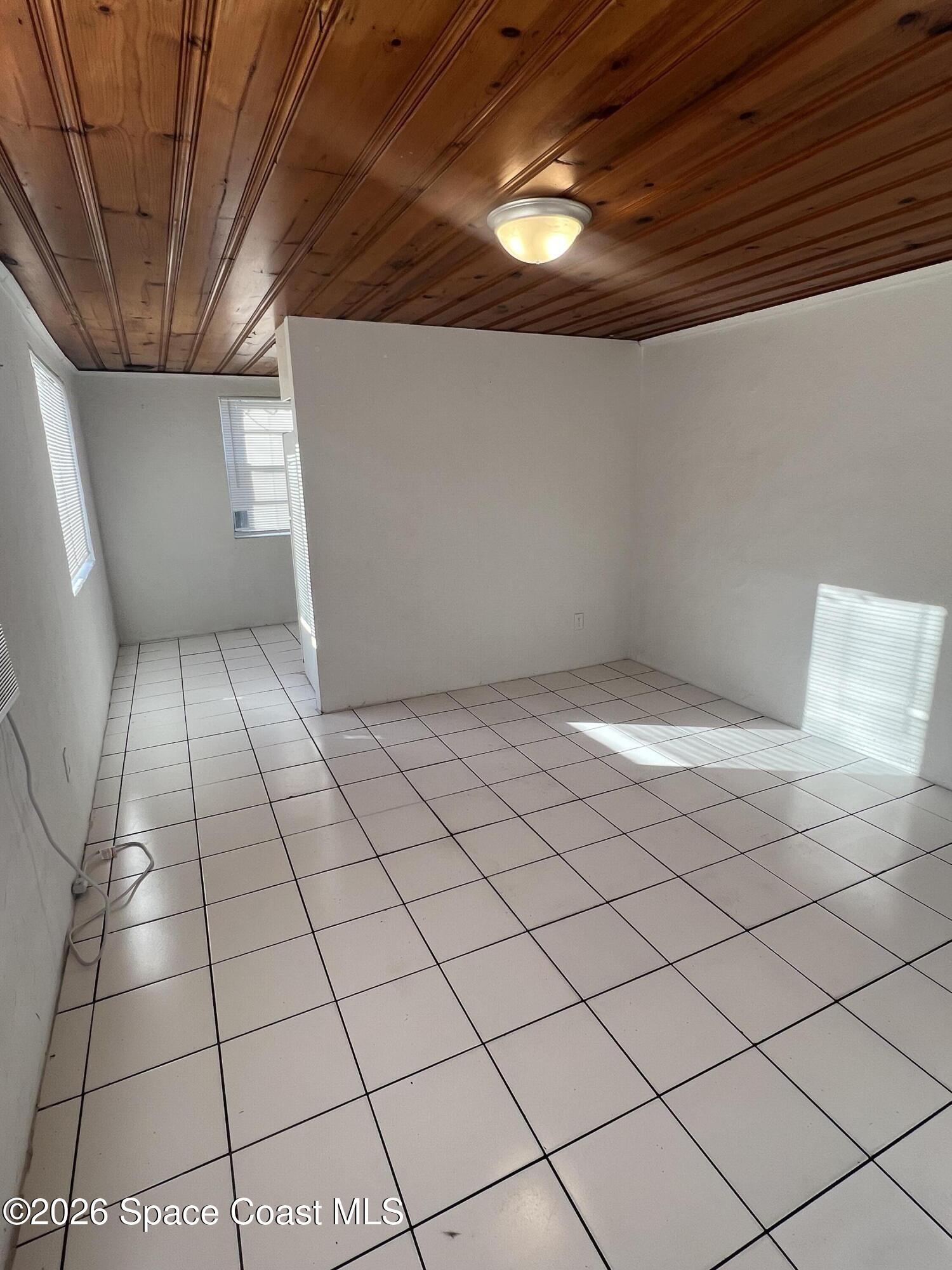 441 Vickers Street, Unit A Melbourne, FL 32935 - Photo 3 of 19 a view of an empty room and window