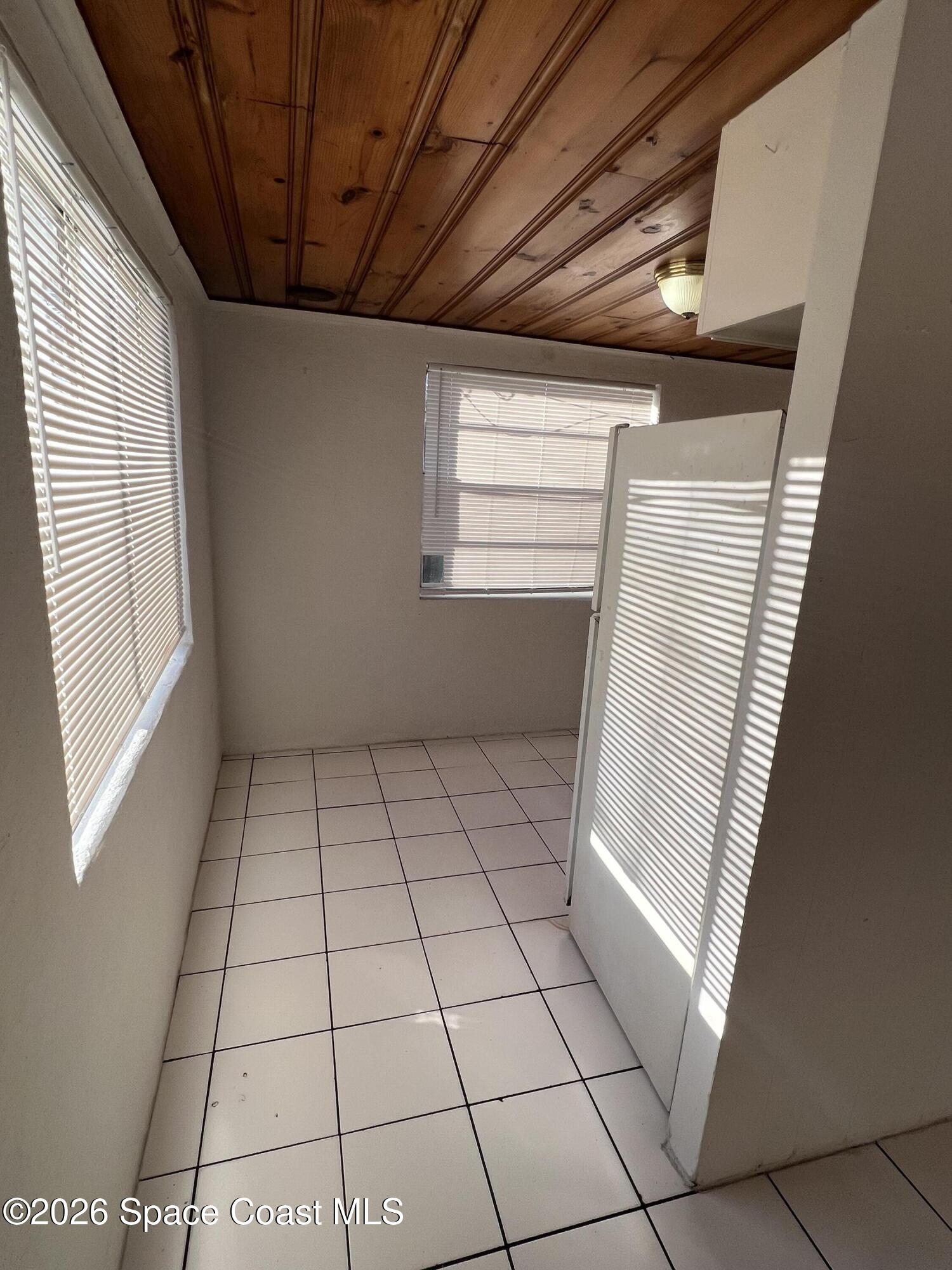 441 Vickers Street, Unit A Melbourne, FL 32935 - Photo 6 of 19 a view of an empty room and window