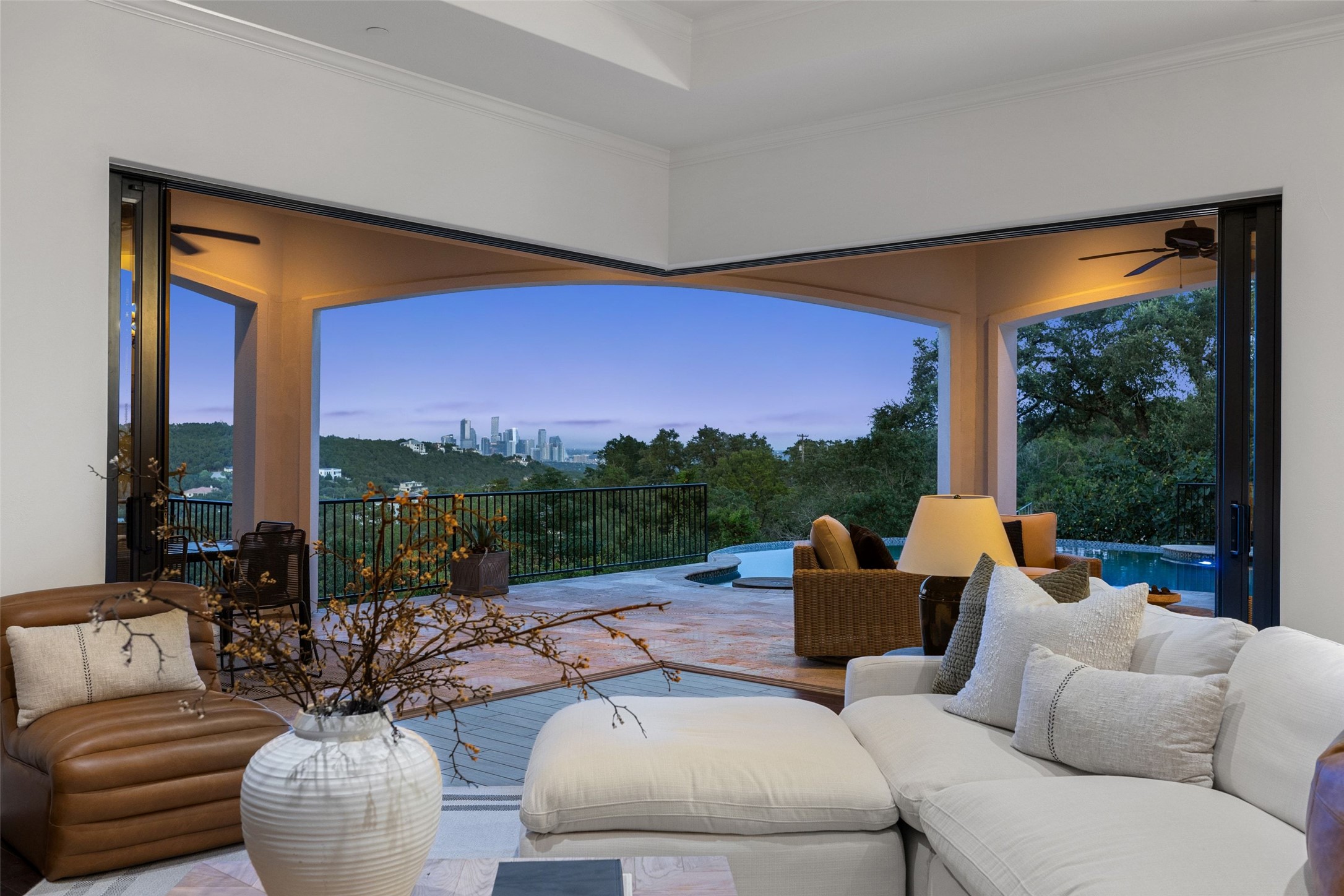 1414 The High Road Austin, TX 78746 - Photo 34 of 40 An airy living area extends to a spacious patio and shimmering pool with captivating city views.