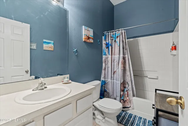 a bathroom with a sink and mirror