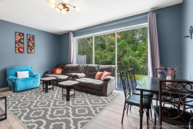 a living room with furniture and a window