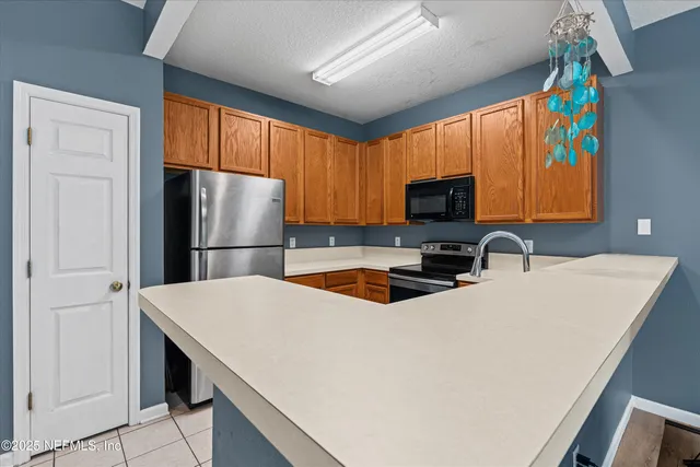 a kitchen with a sink cabinets and window