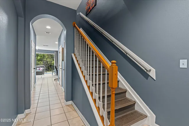 a bedroom with a bed closet and flat screen tv