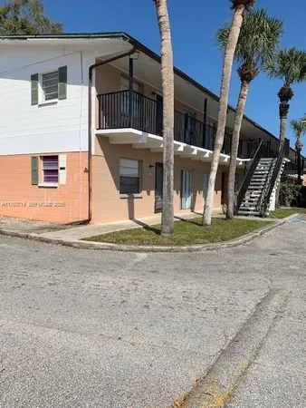 a front view of a house with basket ball court