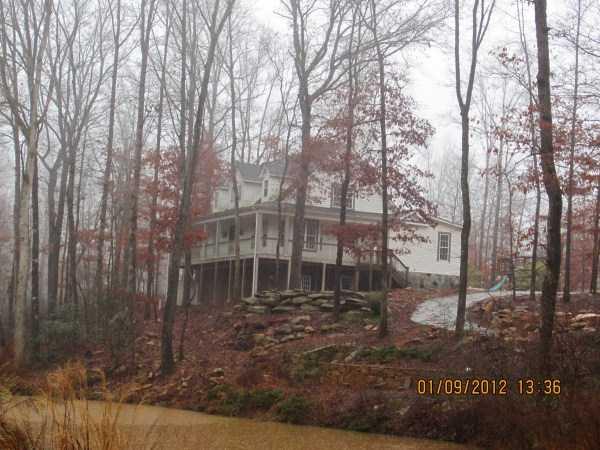 Exterior Front. Home sits up on a hill and overlooks a pond that would be beautiful in the spring and summer!