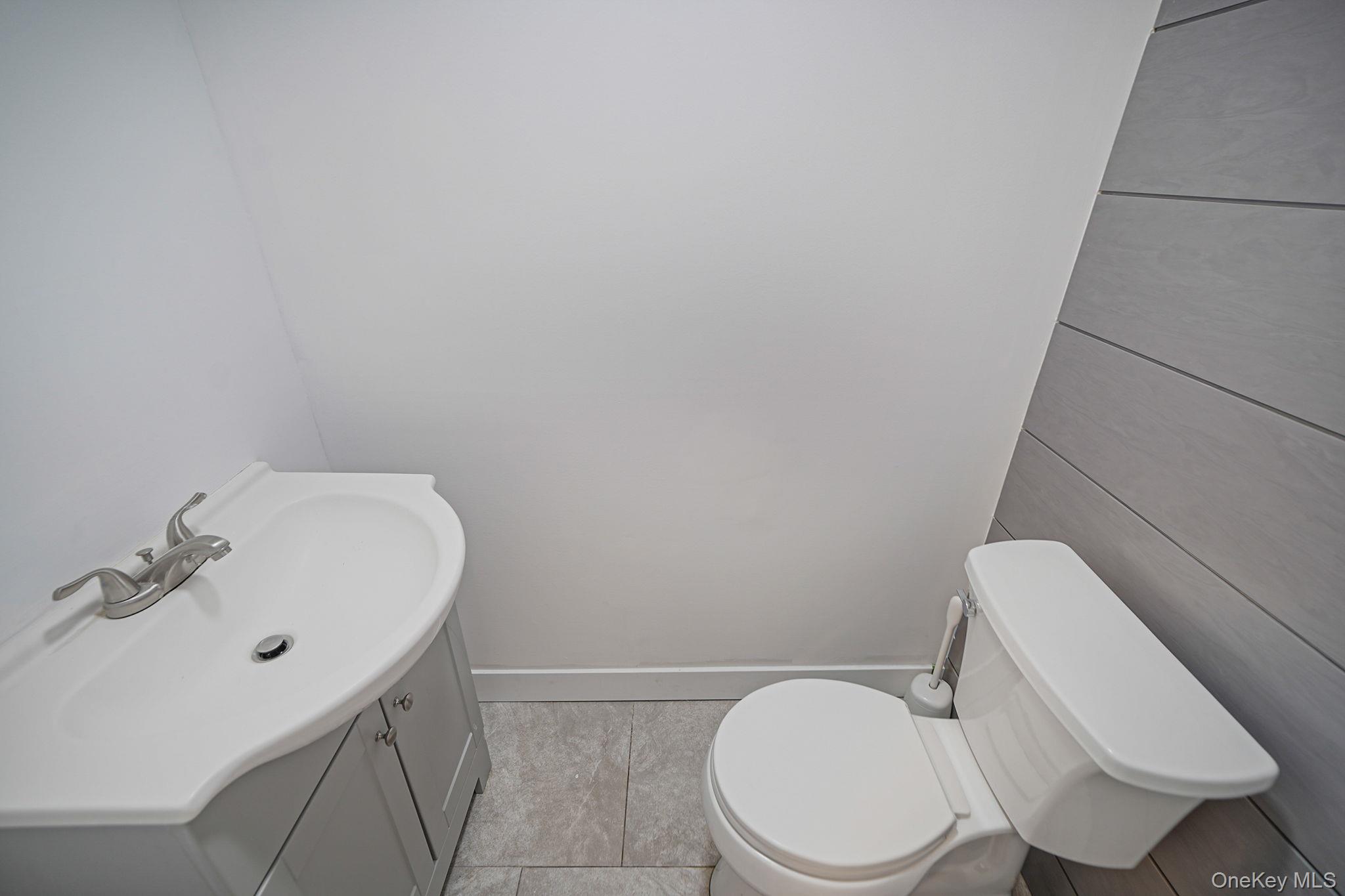 38 Hawthorne Road Rocky Point, NY 11778 - Photo 16 of 30 Bathroom featuring vanity and toilet