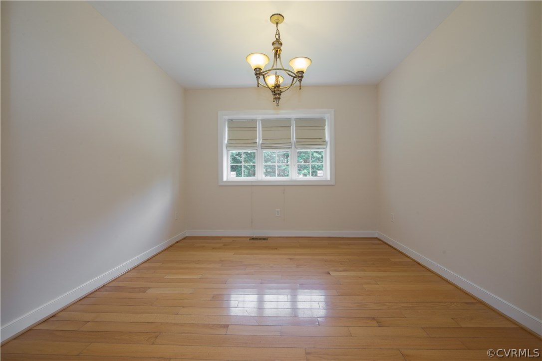 206 North Ridge Road Henrico, VA 23229 - Photo 11 of 30 a view of an empty room with wooden floor and a window