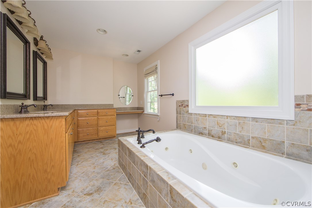 206 North Ridge Road Henrico, VA 23229 - Photo 14 of 30 a bathroom with a bathtub and a sink