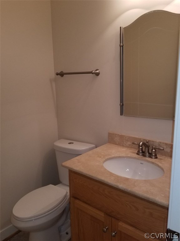 206 North Ridge Road Henrico, VA 23229 - Photo 18 of 30 a bathroom with a granite countertop toilet and a sink