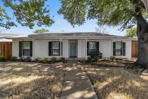a front view of a house with yard