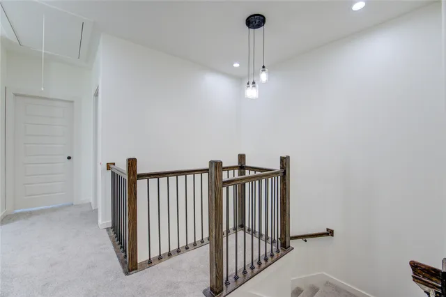 a view of a hallway with a chandelier