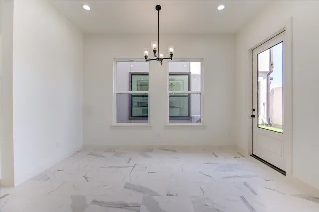 a view of an empty room with windows