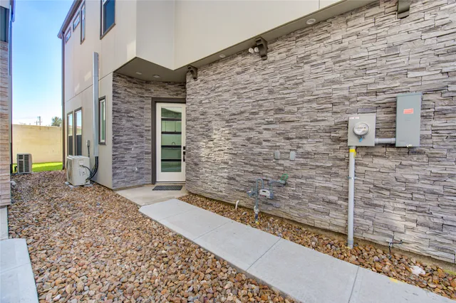 a front view of a house with a brick wall