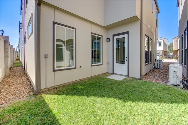 a view of front door of house and yard