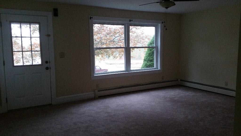 2 Maple Street Saco, ME 04072 - Photo 10 of 22 Living room with large windows for...
