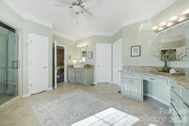 a view of a kitchen with stainless steel appliances granite countertop a sink and cabinets