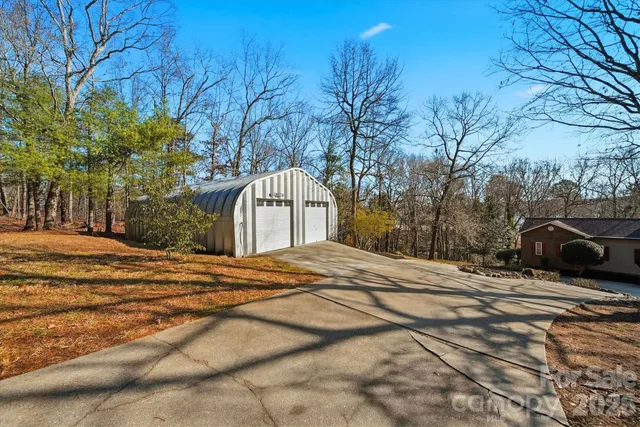a view of a lake with a house in the background
