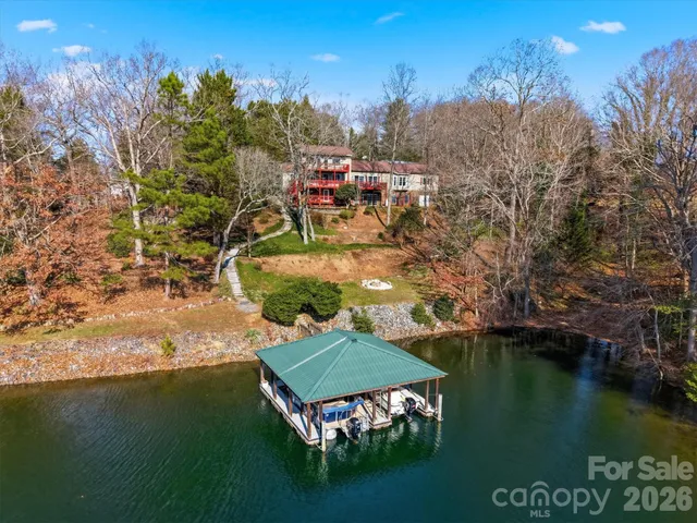 a front view of a residential apartment building with a yard