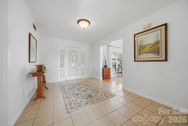 a view of a livingroom with wooden floor and cabinet