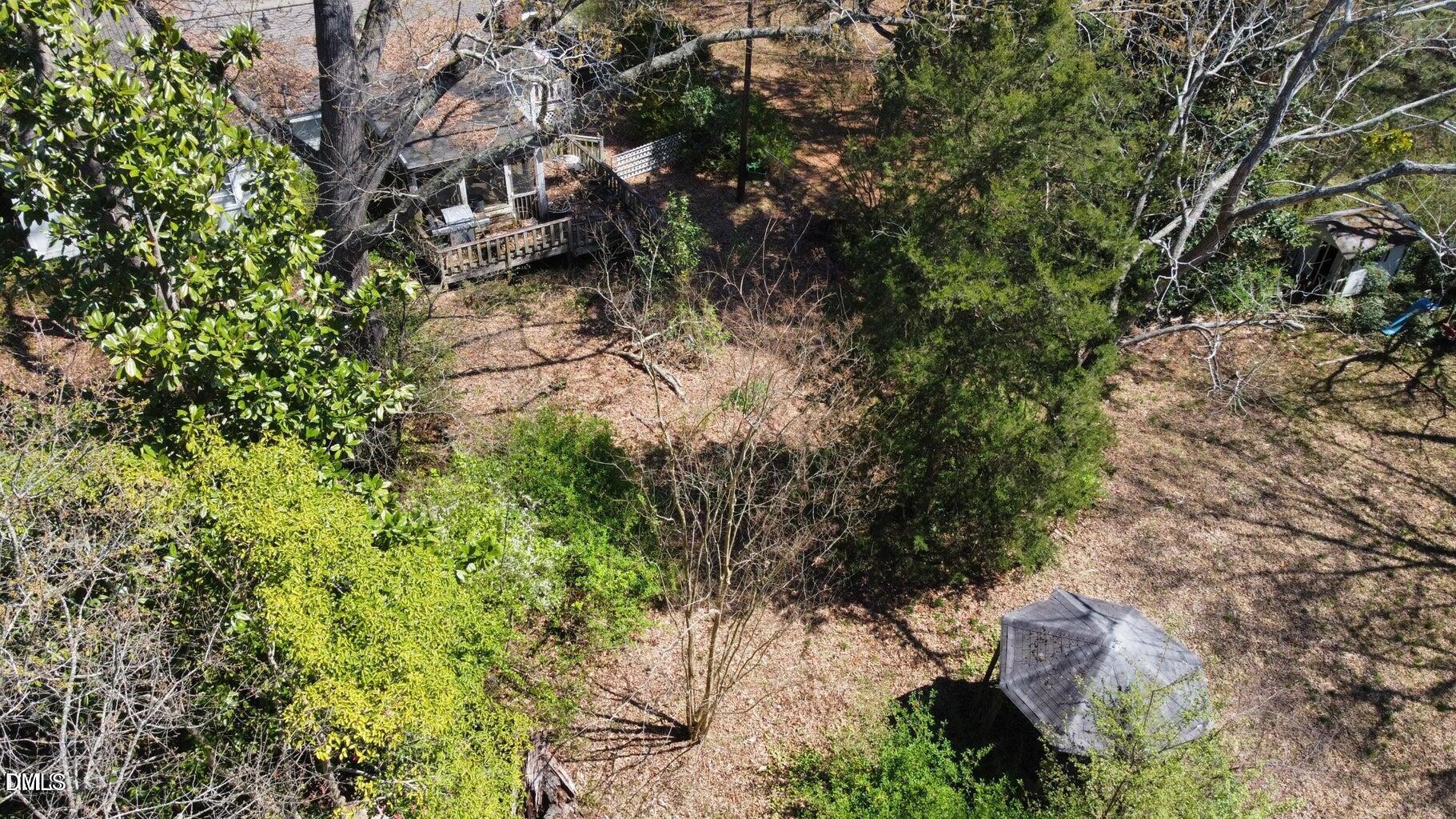 620 Sunnybrook Road Raleigh, NC 27610 - Photo 4 of 9 a backyard of a house with lots of green space