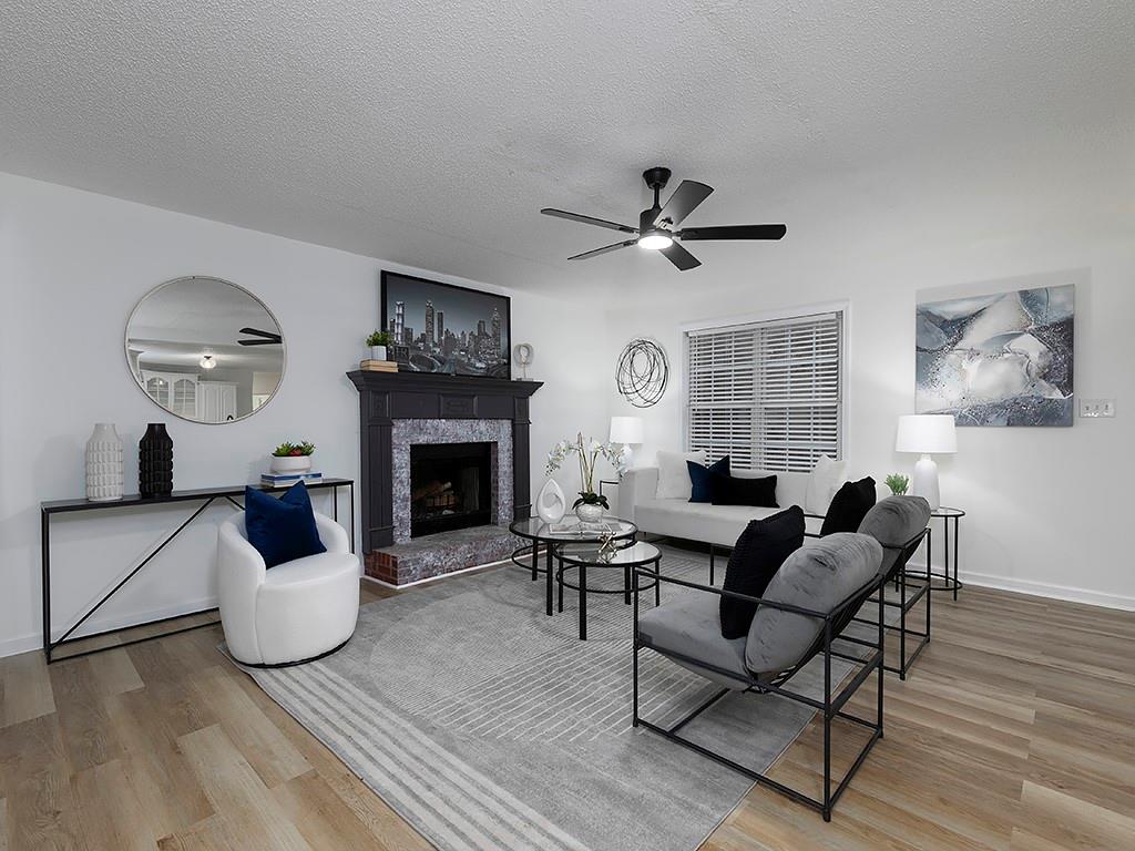 62 Smoak Field Road Griffin, GA 30223 - Photo 16 of 50 a living room with furniture and a fireplace