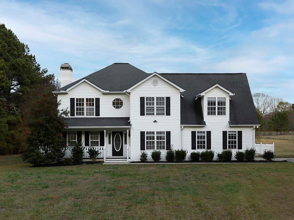 62 Smoak Field Road Griffin, GA 30223 - Photo 2 of 50 a front view of a house with a garden