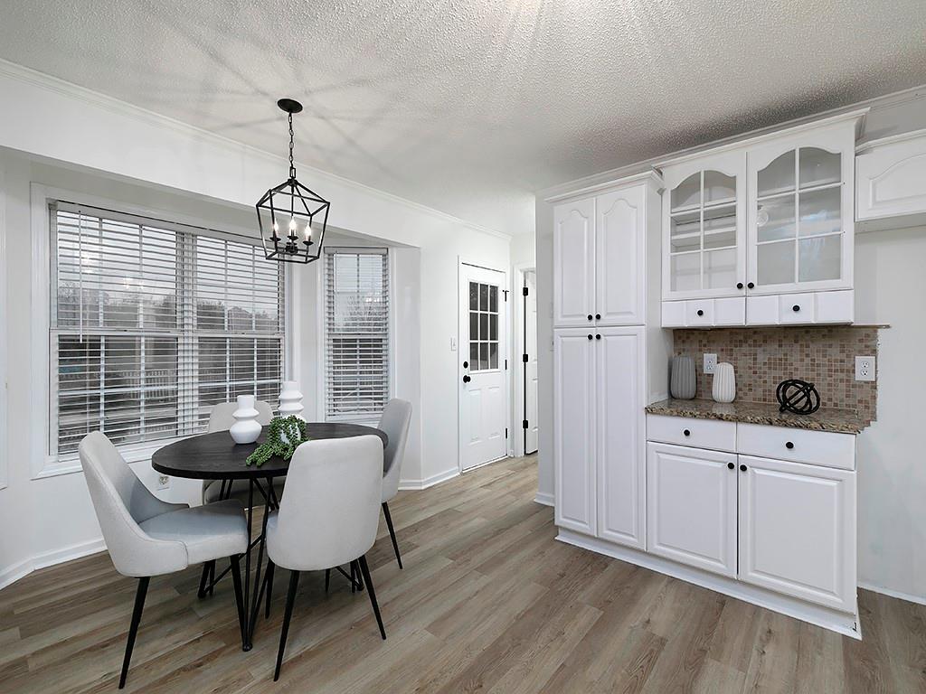 62 Smoak Field Road Griffin, GA 30223 - Photo 23 of 50 a view of a dining room with furniture window and wooden floor