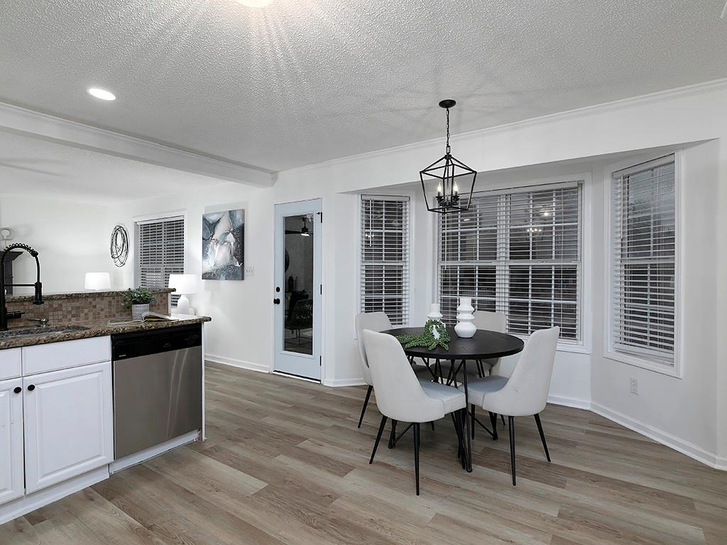 62 Smoak Field Road Griffin, GA 30223 - Photo 24 of 50 a view of a dining room with furniture window and wooden floor