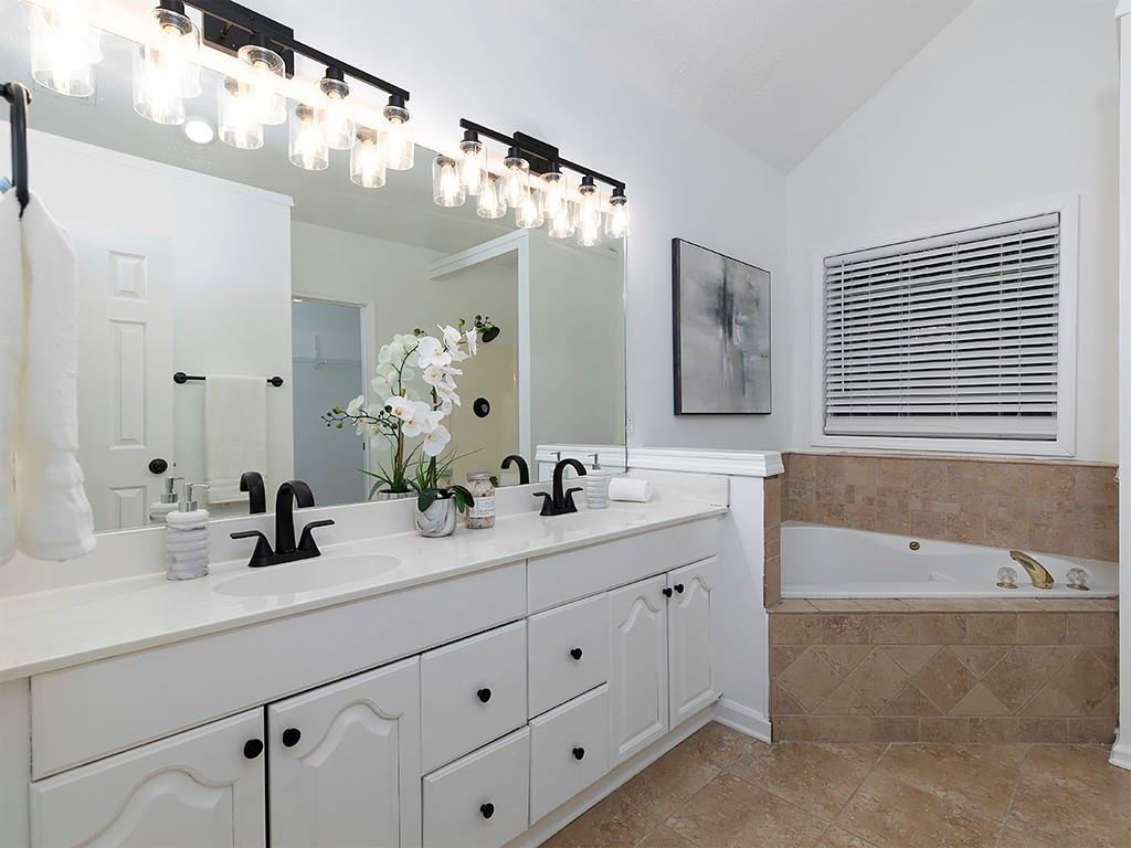 62 Smoak Field Road Griffin, GA 30223 - Photo 31 of 50 a bathroom with a double vanity sink mirror double and bathtub