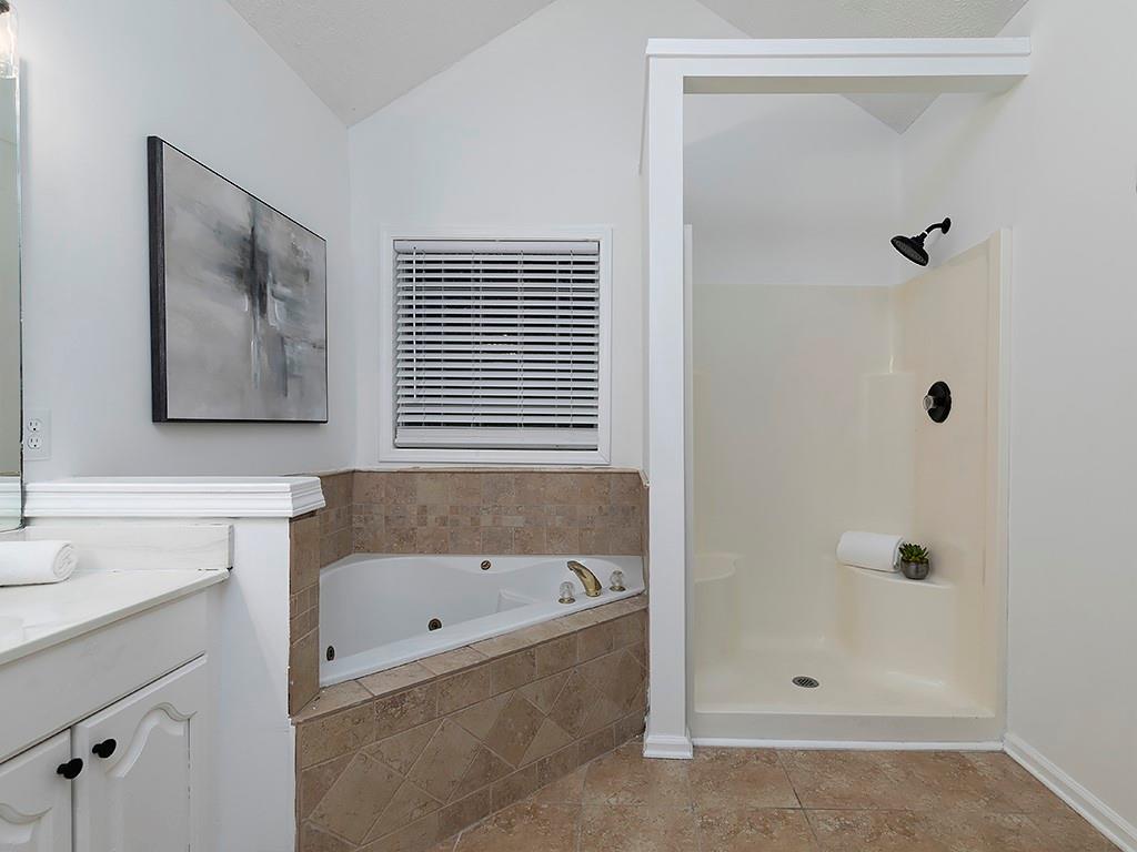 62 Smoak Field Road Griffin, GA 30223 - Photo 32 of 50 a bathroom with a bathtub and shower
