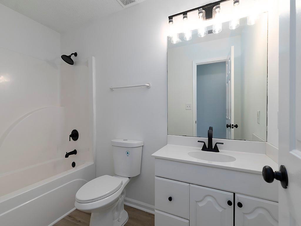 62 Smoak Field Road Griffin, GA 30223 - Photo 40 of 50 a bathroom with a sink a toilet and shower