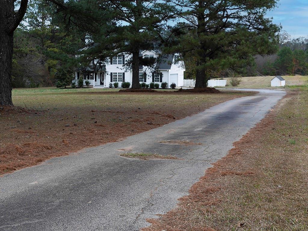 62 Smoak Field Road Griffin, GA 30223 - Photo 41 of 50 a view of a city street lined with buildings and trees