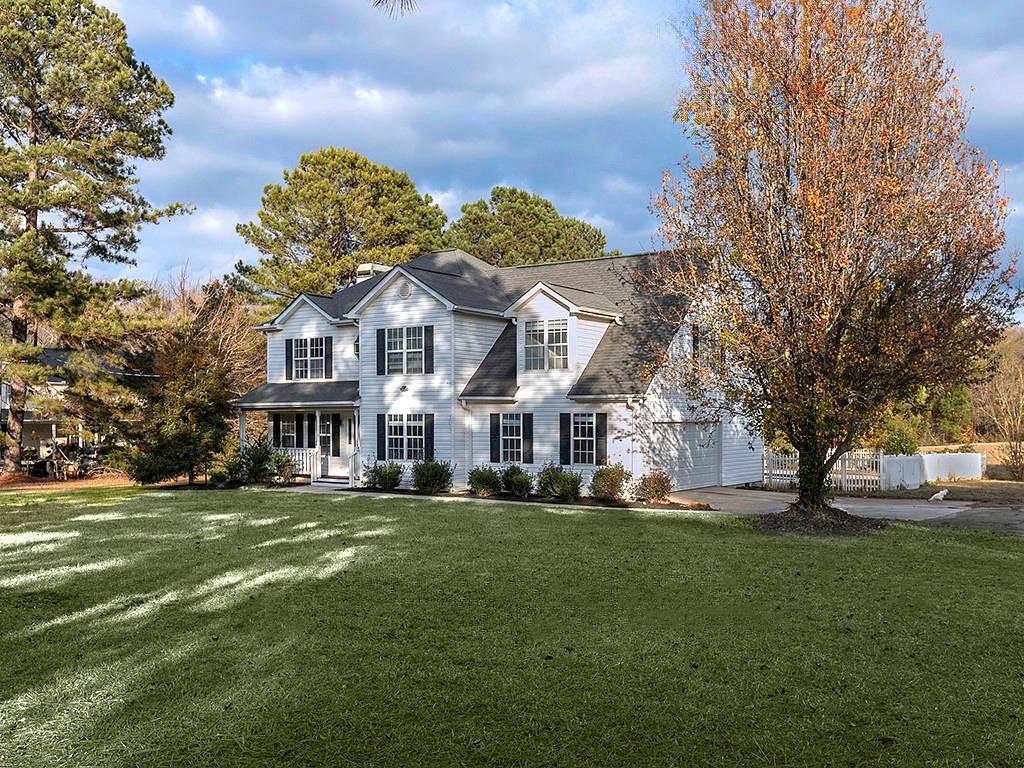 62 Smoak Field Road Griffin, GA 30223 - Photo 8 of 50 a front view of a building with a garden