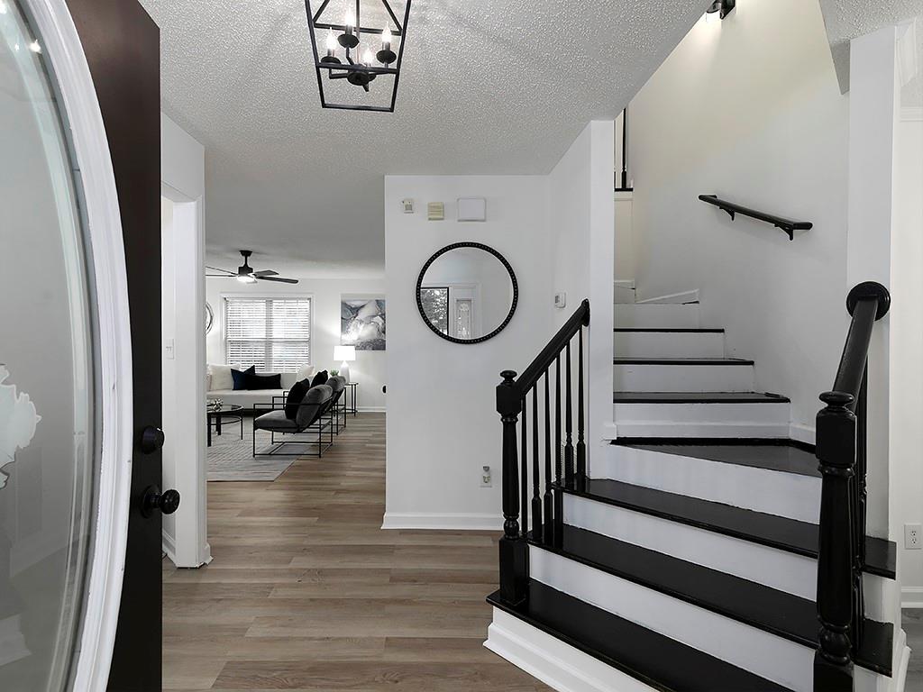 62 Smoak Field Road Griffin, GA 30223 - Photo 9 of 50 a view of a hallway with wooden floor and furniture