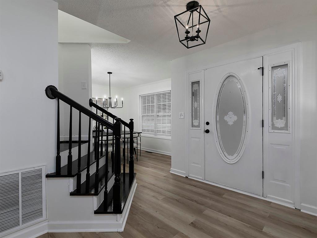 62 Smoak Field Road Griffin, GA 30223 - Photo 10 of 50 a view of a hallway with wooden floor and stairs