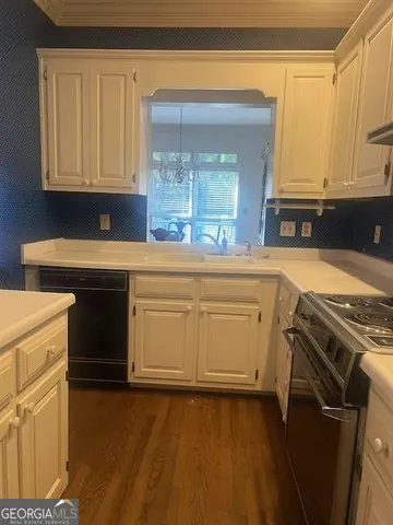 a kitchen with a stove and a sink