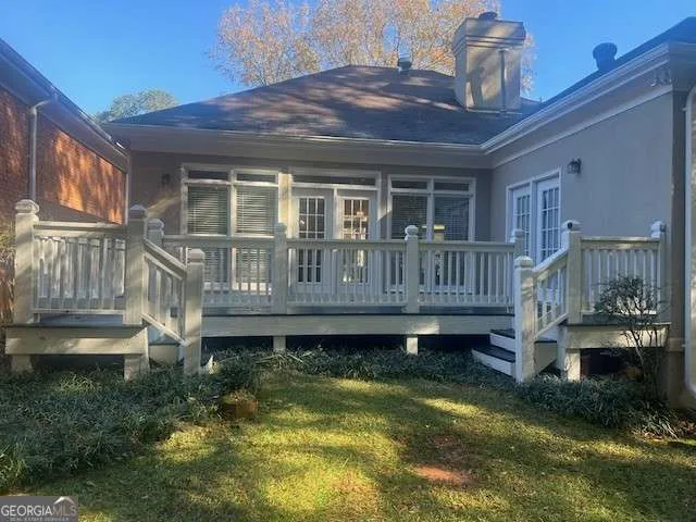 a front view of house with yard swimming pool and outdoor seating