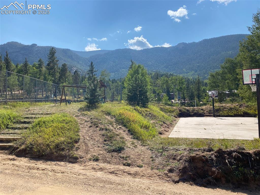 116 Happy Valley Road Manitou Springs, CO 80829 - Photo 22 of 25 a view of a swimming pool with a yard