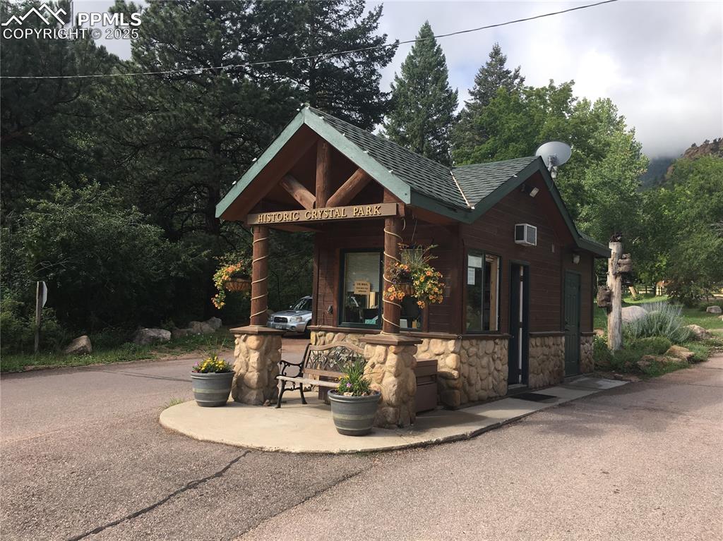 116 Happy Valley Road Manitou Springs, CO 80829 - Photo 25 of 25 a front view of a house with sitting area and garden