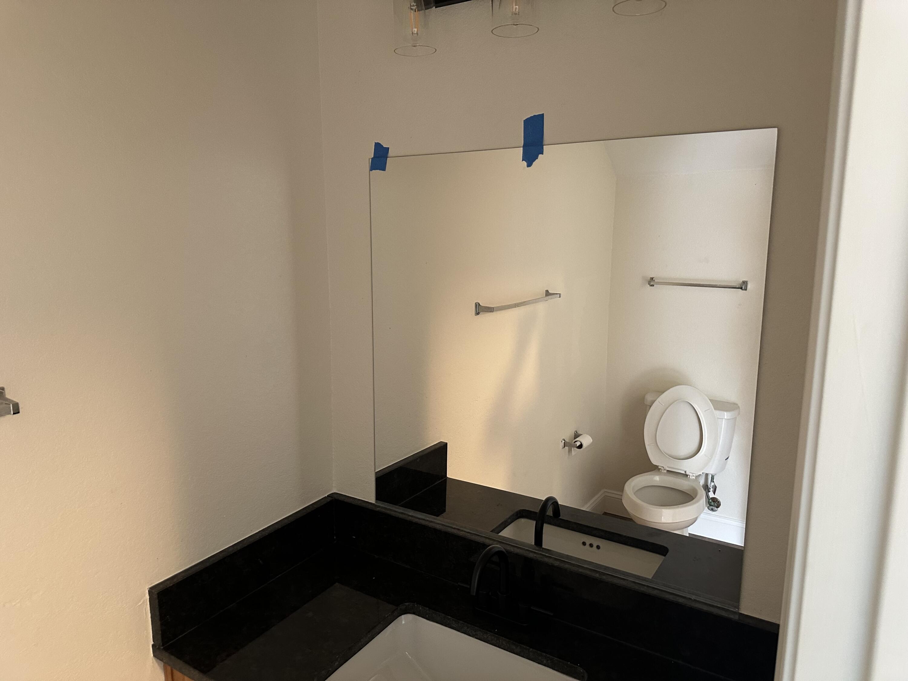 1150 Airport Road, Unit 138 Destin, FL 32541 - Photo 14 of 16 a picture of a bathroom with a sink and a mirror
