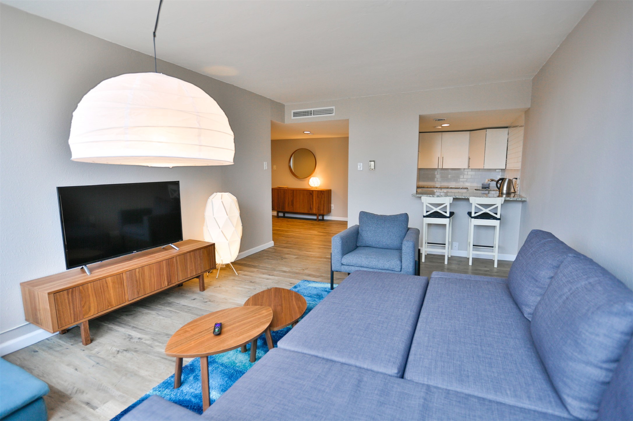 1800 Lavaca Street, Unit A608 Austin, TX 78701 - Photo 2 of 12 Living room featuring wood finished floors and baseboards