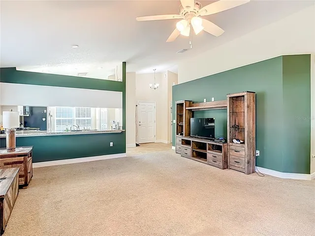 an outdoor room with furniture and windows