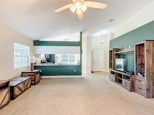 a bathroom with a granite countertop toilet sink and mirror