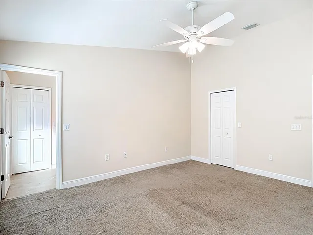 an aerial view of residential houses with outdoor space and swimming pool