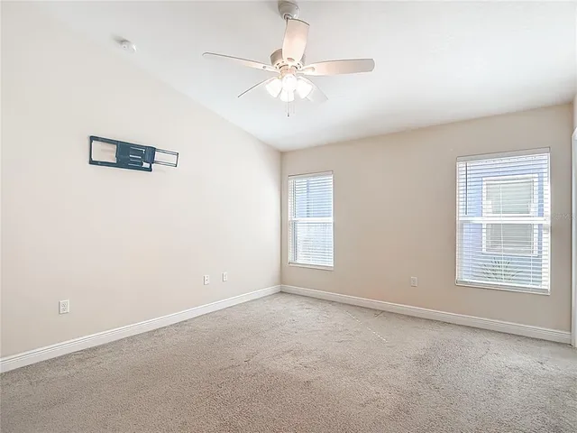 an aerial view of residential houses with outdoor space and street view