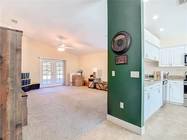 a kitchen with stainless steel appliances granite countertop a sink and cabinets