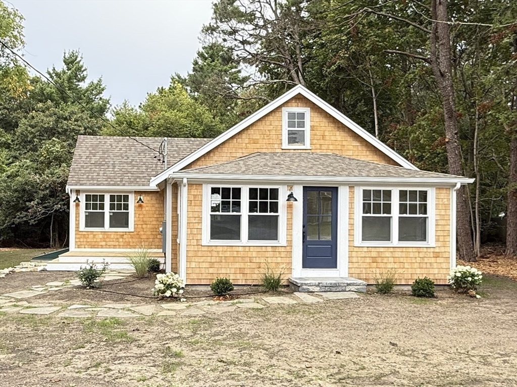 1469 Santuit-Newtown Road Barnstable, MA 02635 - Photo 1 of 18 a front view of a house with a yard