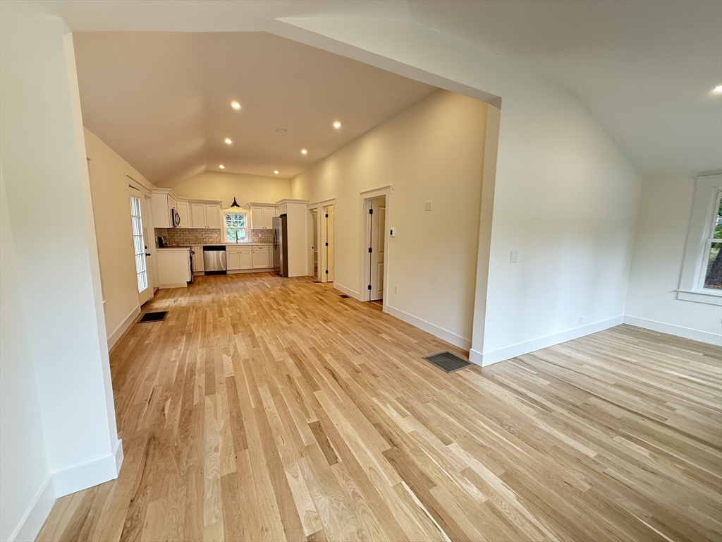 1469 Santuit-Newtown Road Barnstable, MA 02635 - Photo 7 of 18 a view of a living room hardwood floor and a kitchen